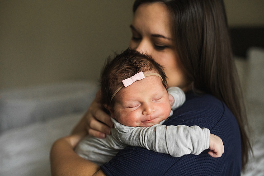 Seattle newborn photography, Baby girl newborn photos, Baby wearing a tiny bow 