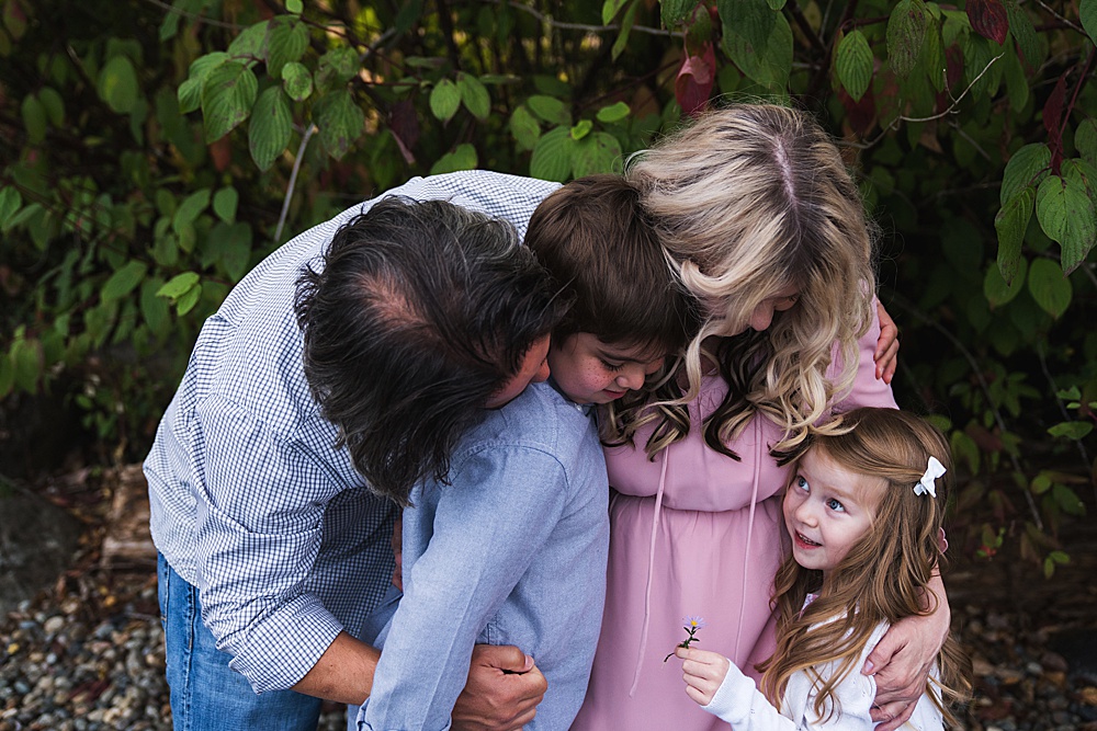 Prepare for a family photo session, Seattle family photographer, Photo of family of four hugging