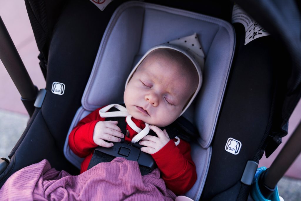 infants at Disneyland, sleeping baby in carseat at Disneyland