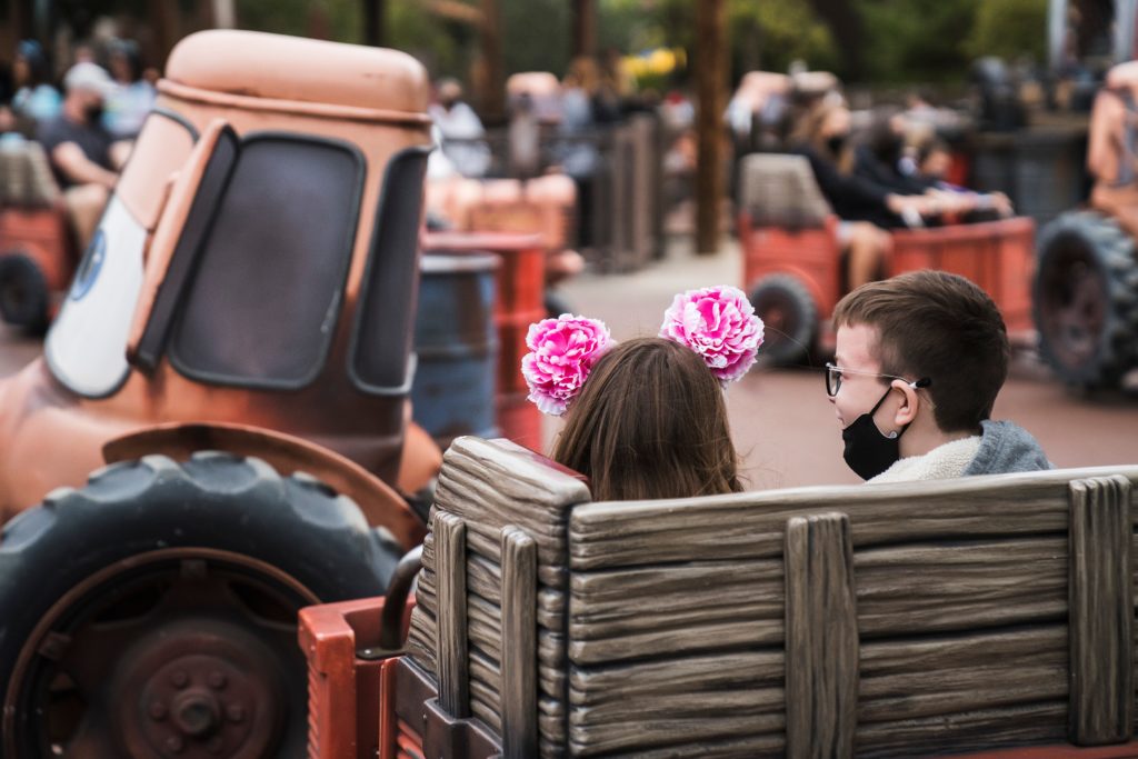 Older kids riding Maters Junkyard Jamboree in Disneyland