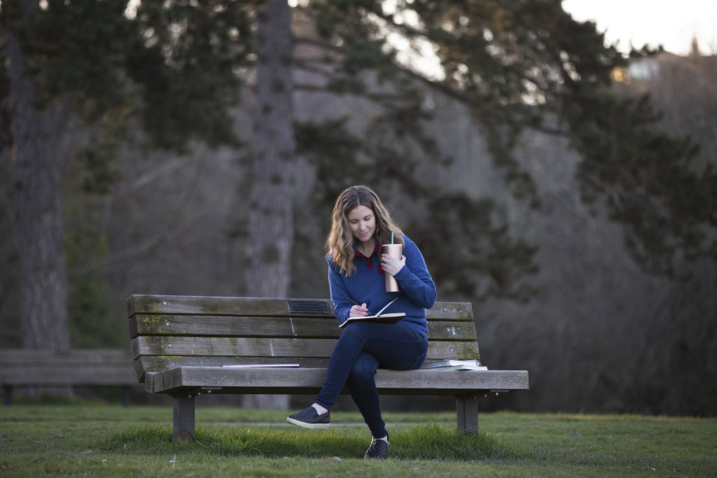 Blogging Mistakes to Avoid, Neyssa Lee sitting on park bench blogging