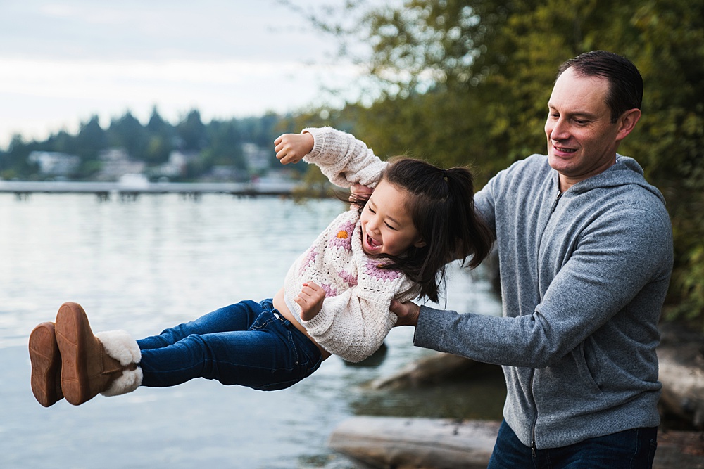Dressing for family photos, Mercer Island Father and Daughter playful photo