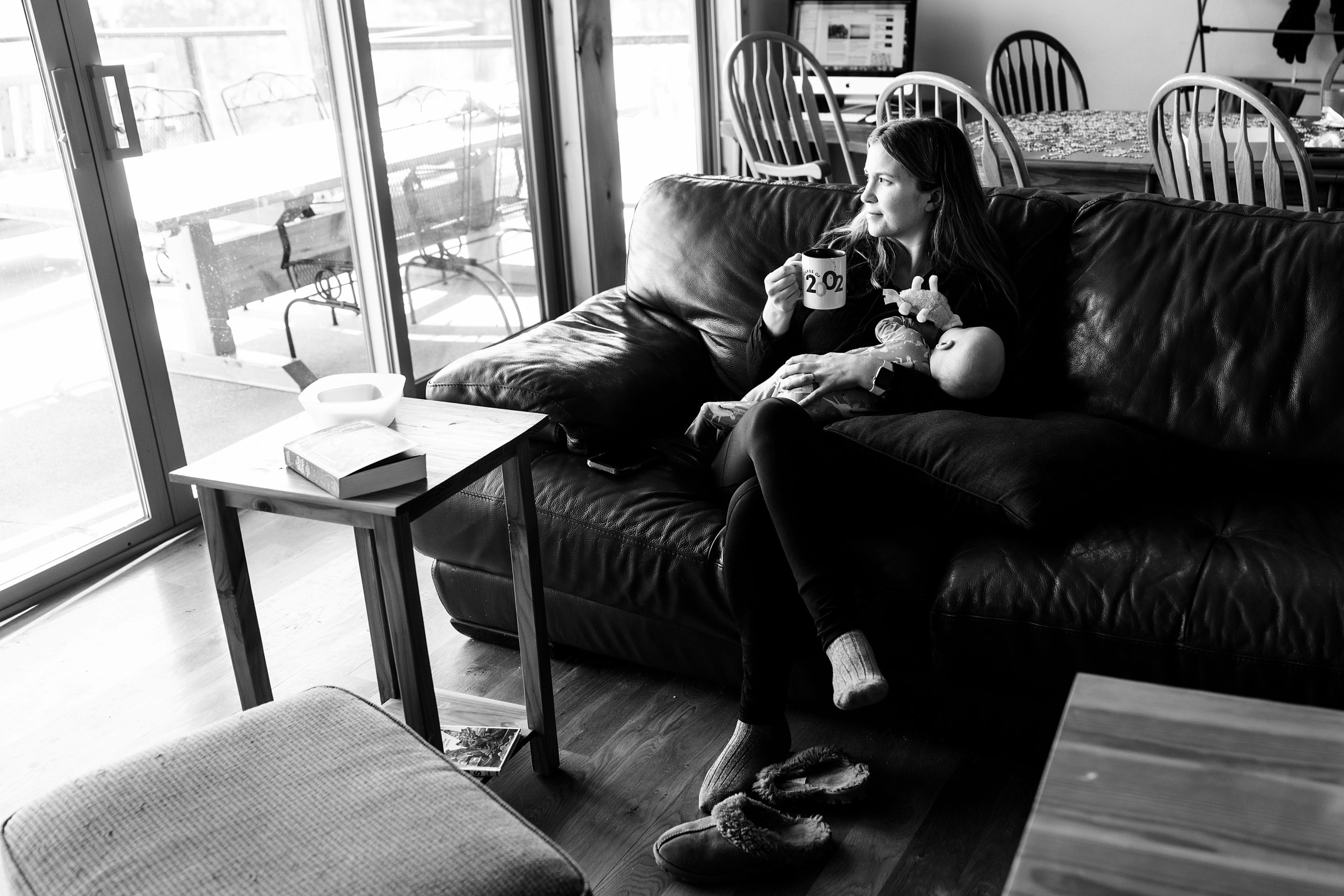 creating a photography business with Seattle photographer Neyssa Lee, photo of mother sitting on couch with baby and coffee