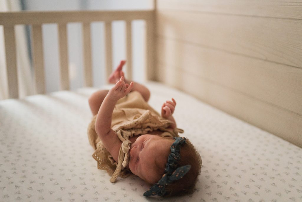 newborn baby in crib during Seattle newborn photo session