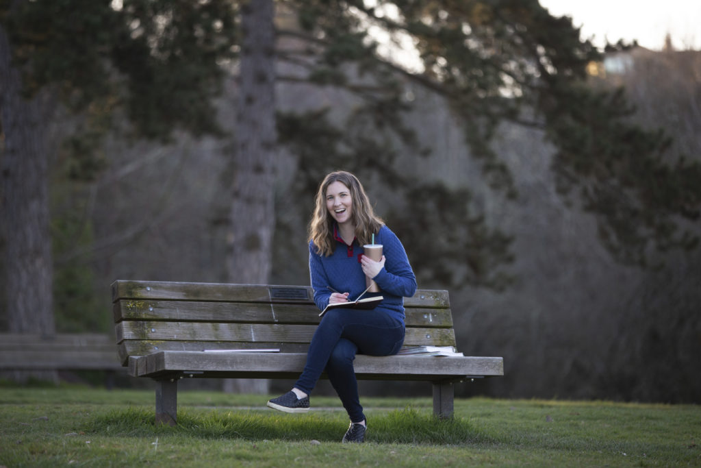 Neyssa Lee , sitting on a bench,shares blog writing tips