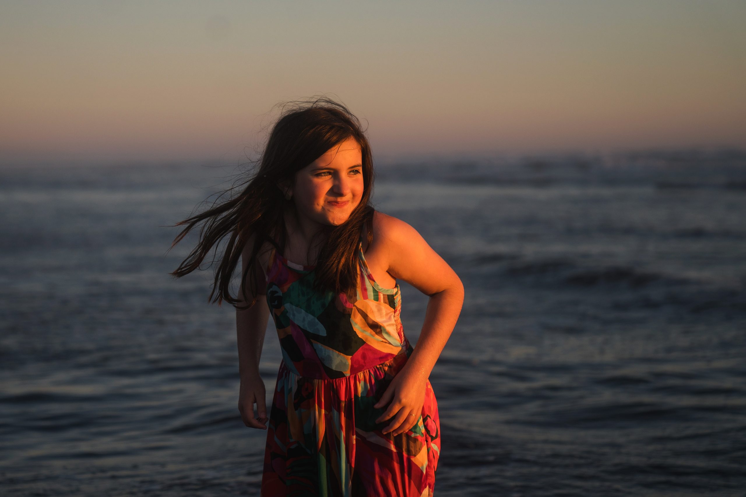 girl standing in ocean at Pacific Beach