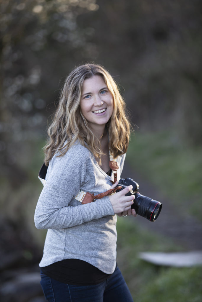 Seattle photographer, who shares her weekly habits, stands with her camera outside