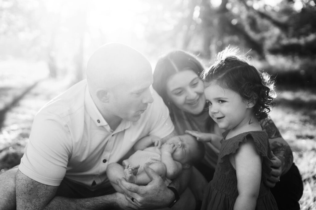 Seattle lifestyle family photography of family of four with young girl and newborn