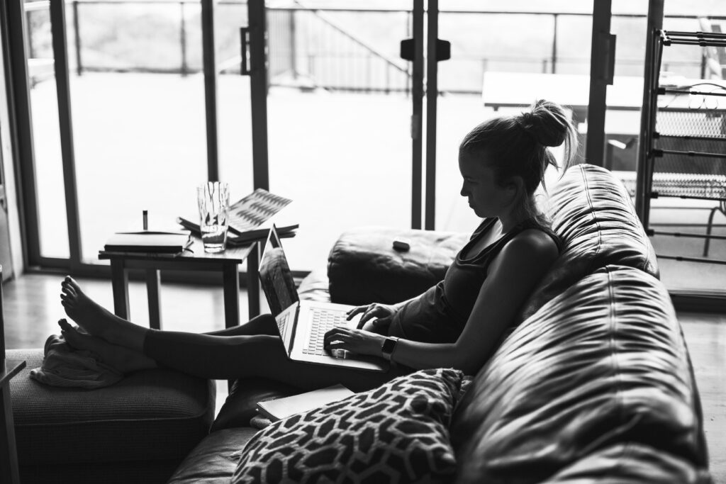 Black and white photo of Neyssa Lee writing a blog