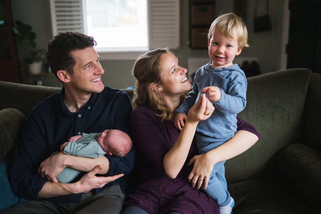 Newborn portraits with big brother, mom, dad during Seattle in home session