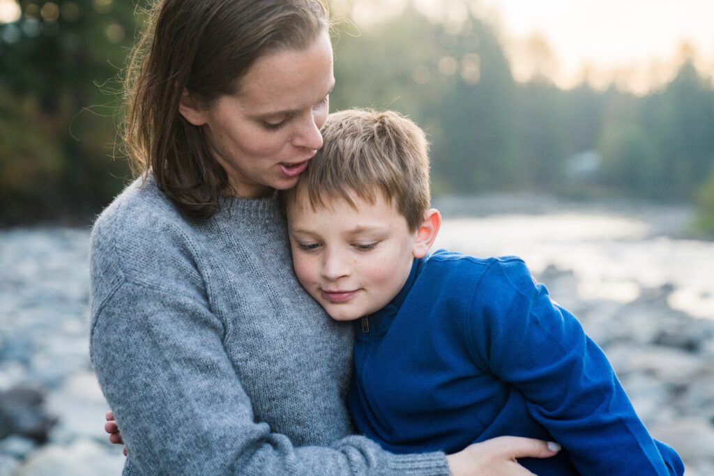 Mother and son during lifestyle family photos at Tanner landing Park in North Bend, Wa