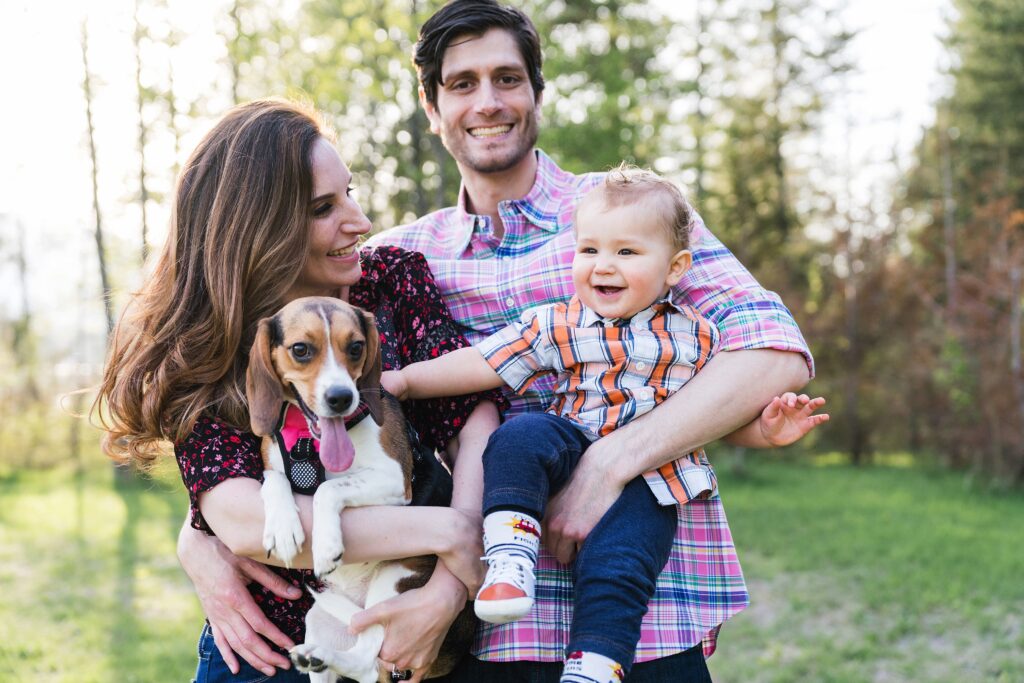 Parents with beagle and one year old son during family photos in the Snoqualmie Valley.