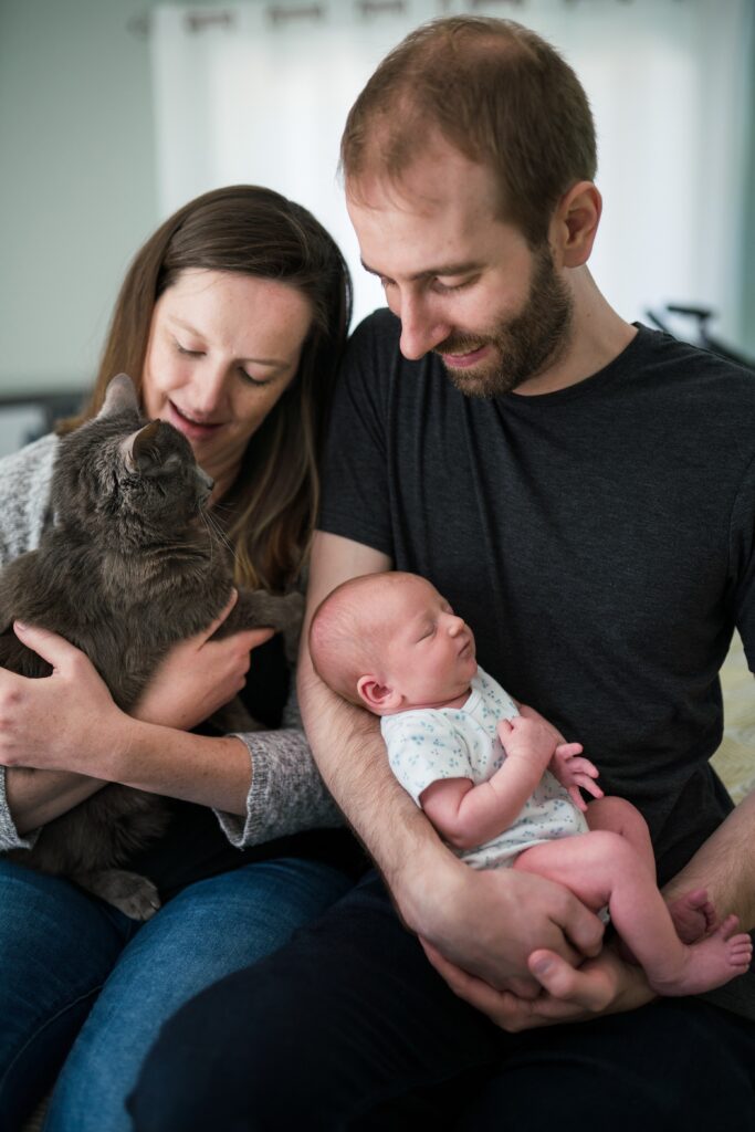 Family with kitty cat and newborn baby for Seattle newborn photography session