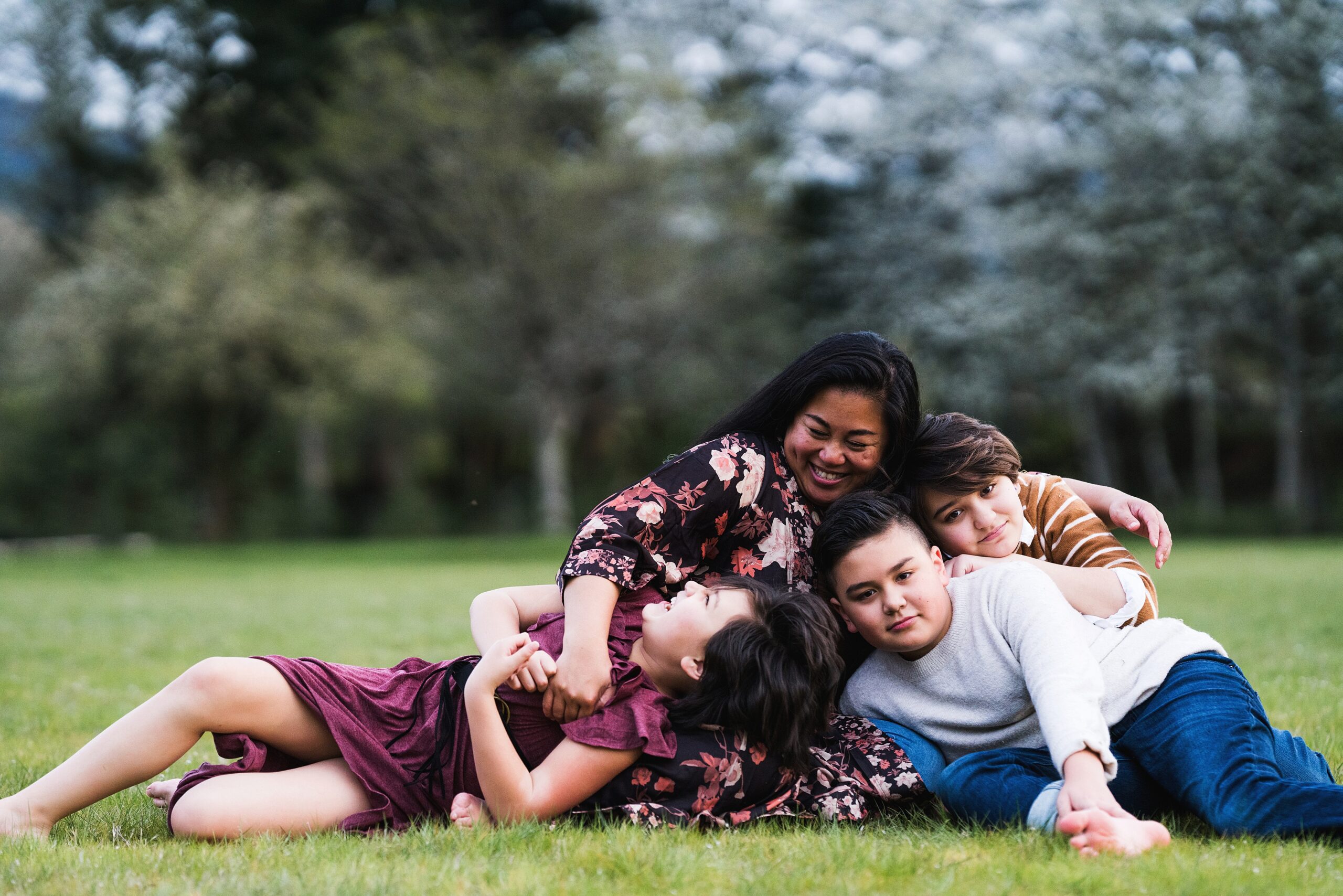Mother with three children during Seattle family photo session at Tanner Landing Park