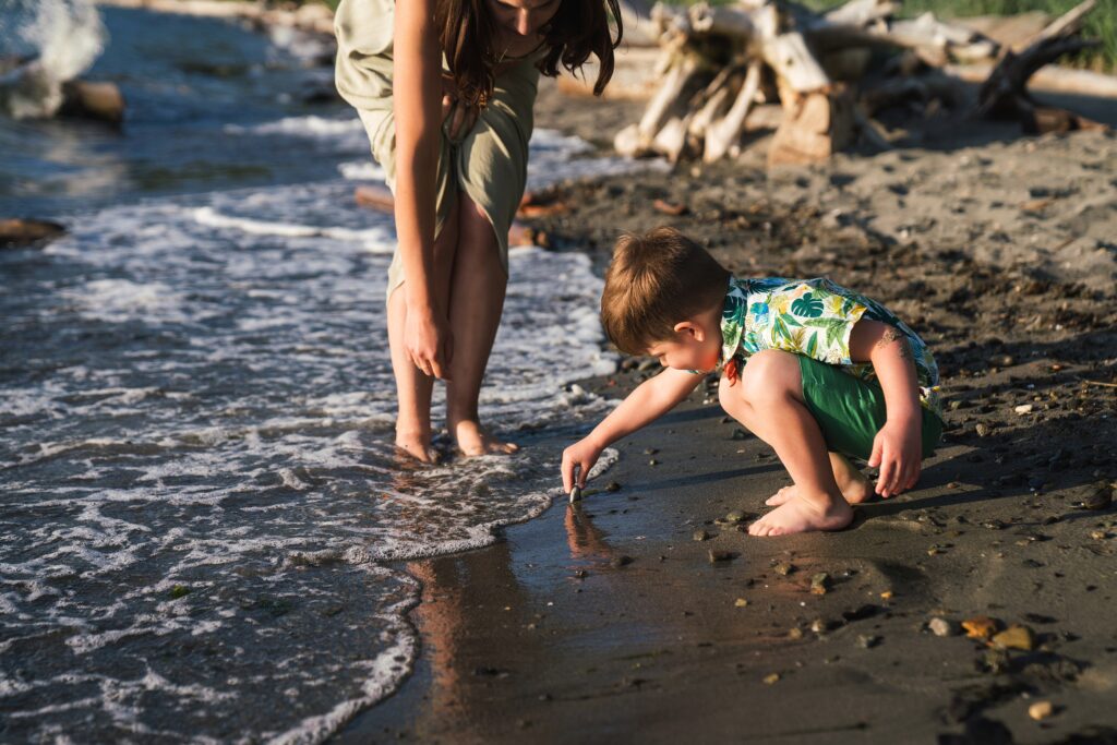 Finding rocks on the beach during family photo session in Seattle
