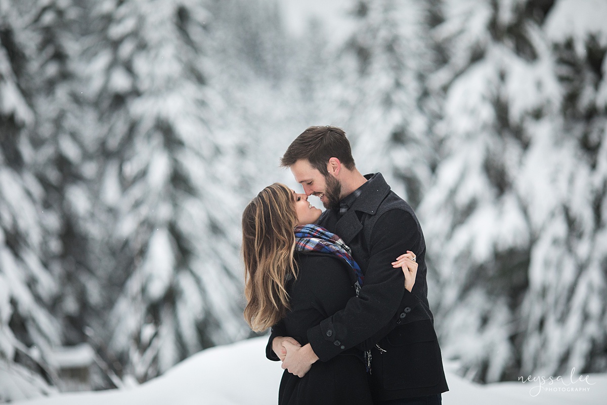 Winter maternity photos at Snoqualmie Pass with snowy trees