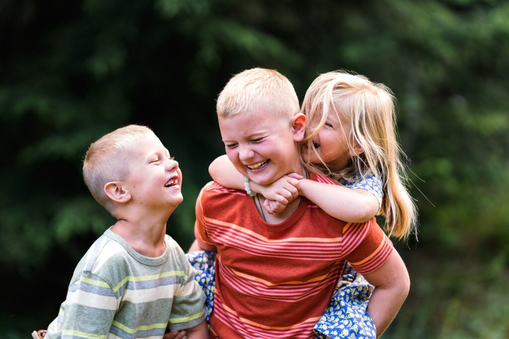 Children laughing during family portraits