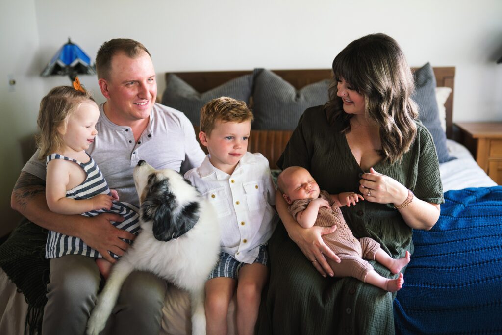 Maternity and newborn photography of family of 5 with puppy dog