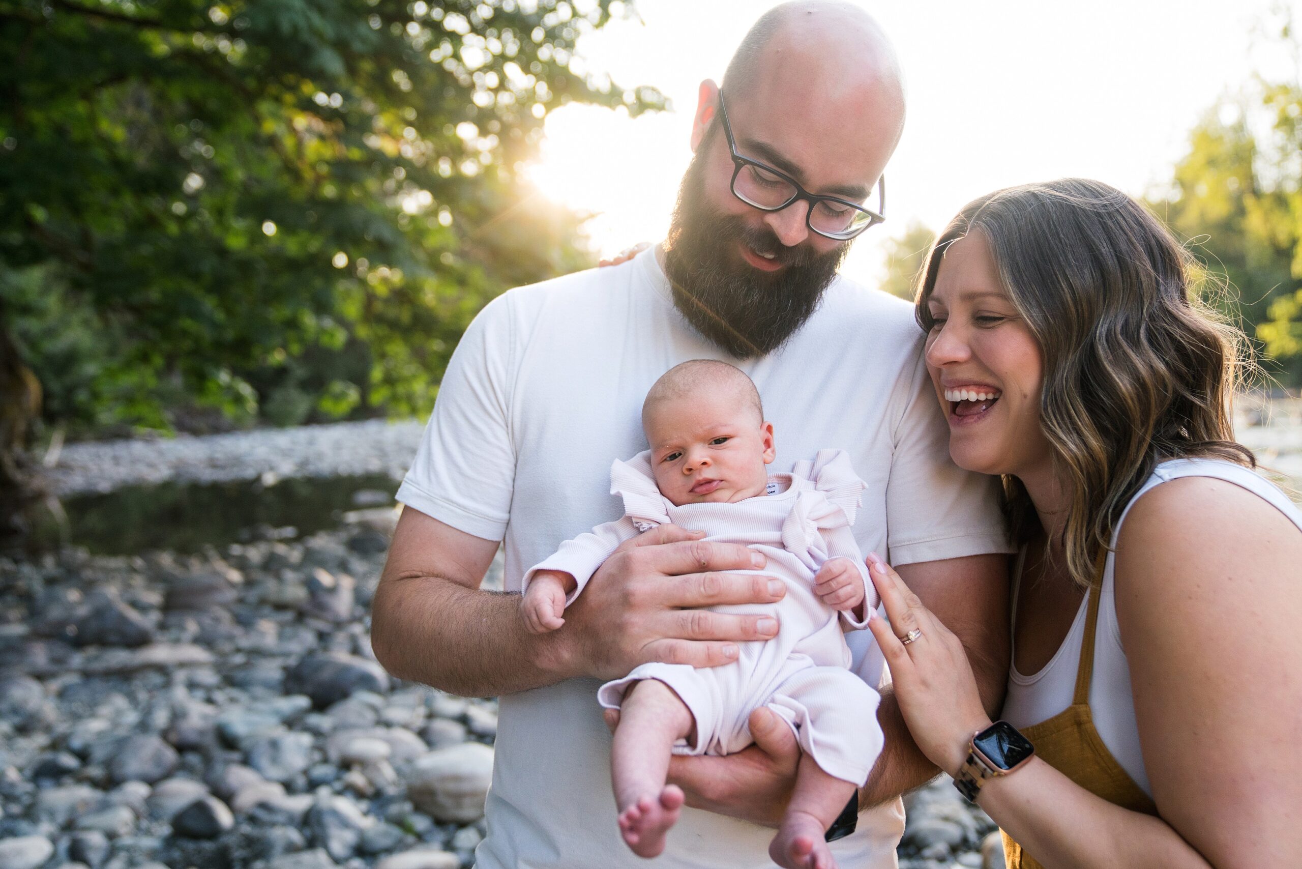Summer outdoor newborn photo of family at the Snoqualmie River, Tanner Landing Park