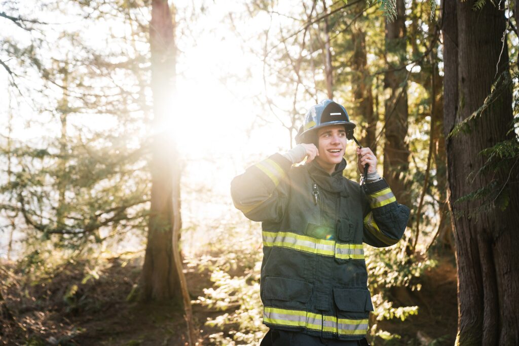 High School Senior in Firefighter gear for portraits at Tanner Landing Park, North Bend, Wa