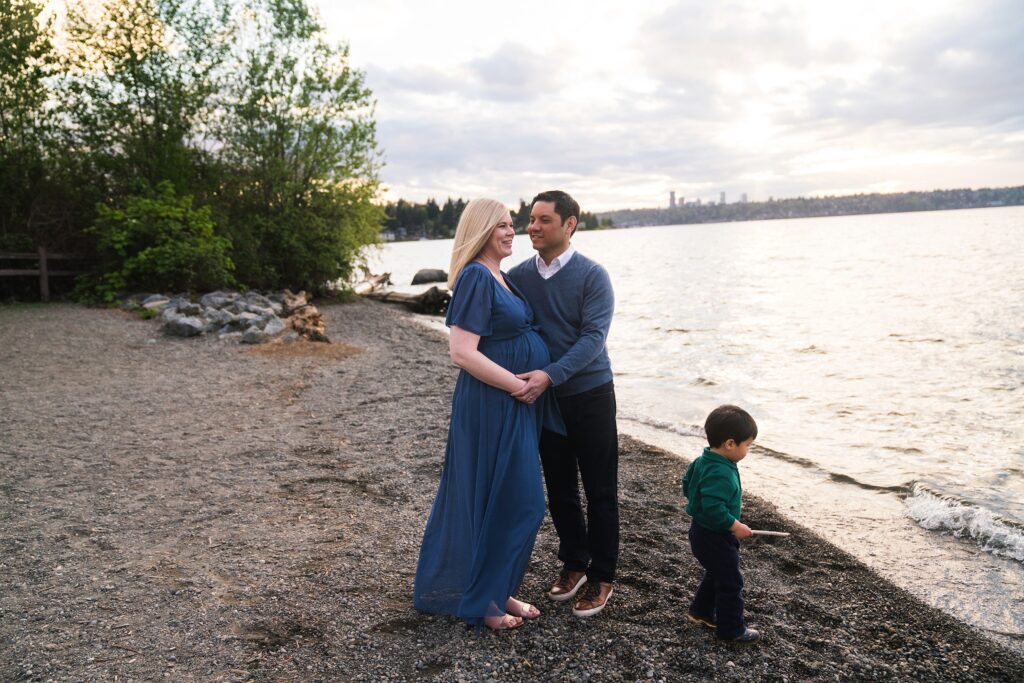 Family Maternity Photos of preschool aged boy with parents by the water on Mercer Island