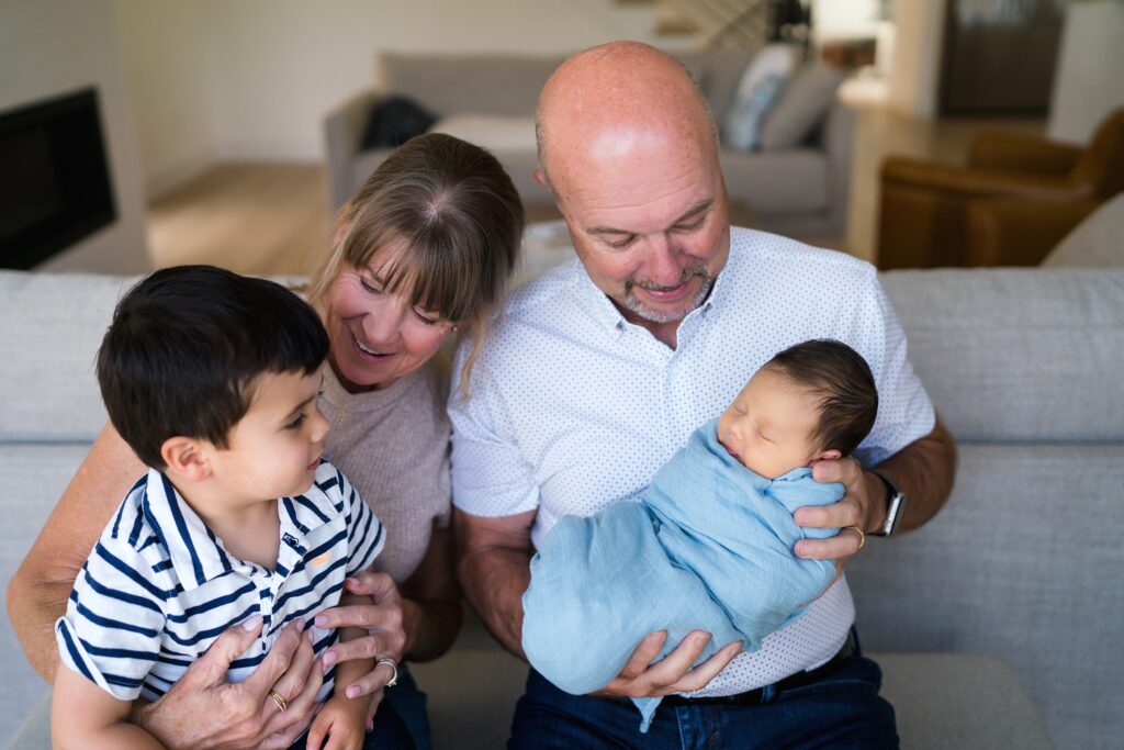 Grandparents with grandkids during newborn session, extended family newborn photo