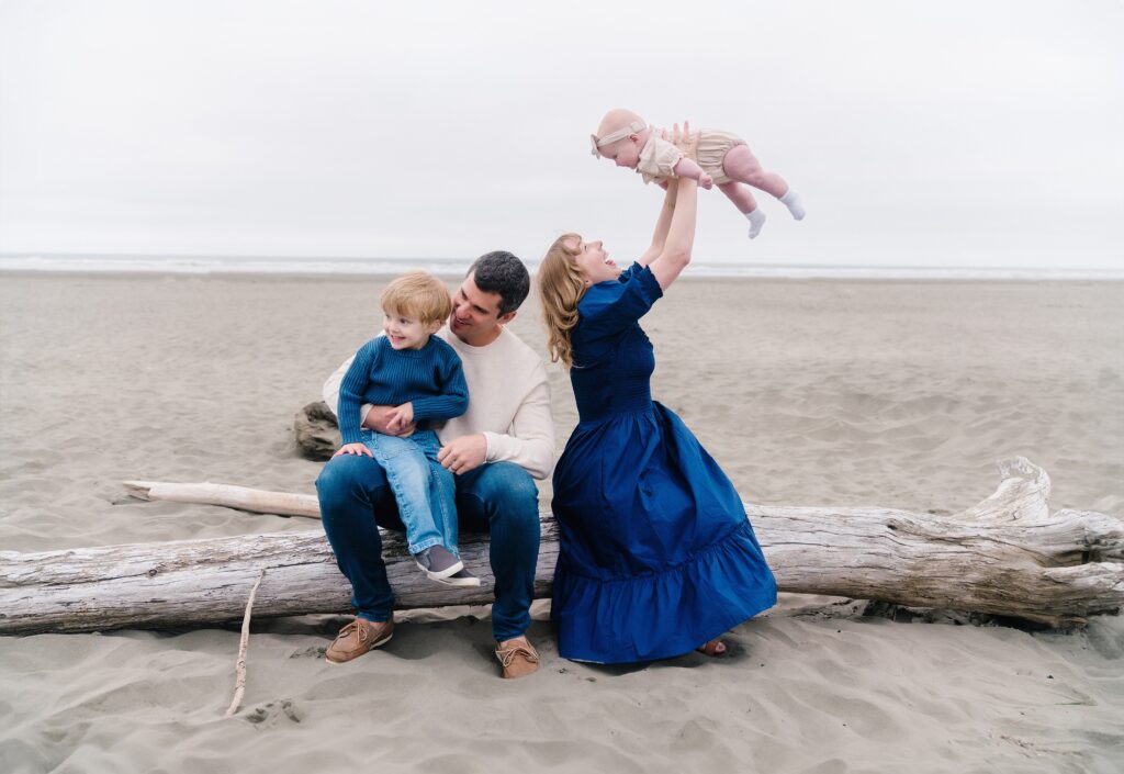 Family of four with baby on the beach on Washington Coast for portrait session near Seabrook