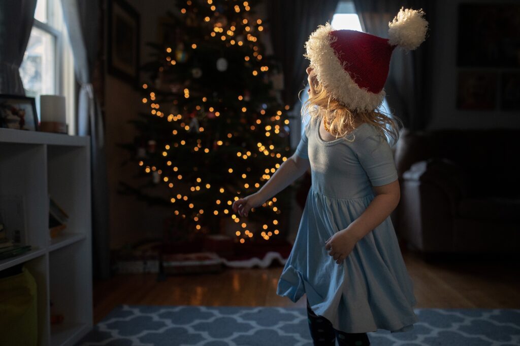 Remie Girl dress on girl twirling in front of Christmas Tree