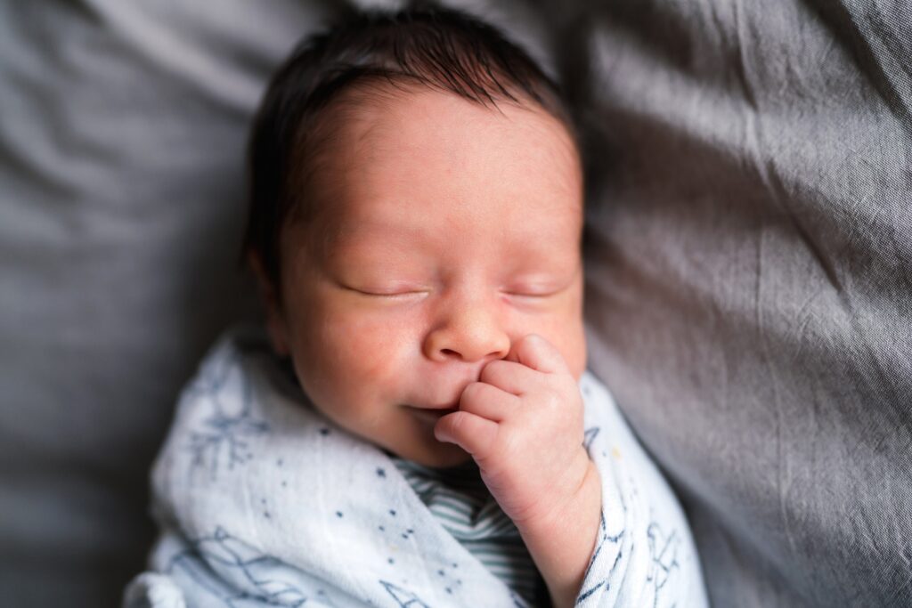 Baby swaddled on bed sleeping, Baby portrait