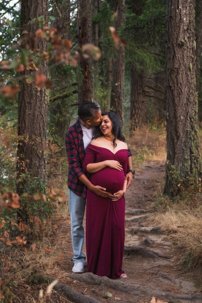 Indian couple in the woods for fall maternity pictures