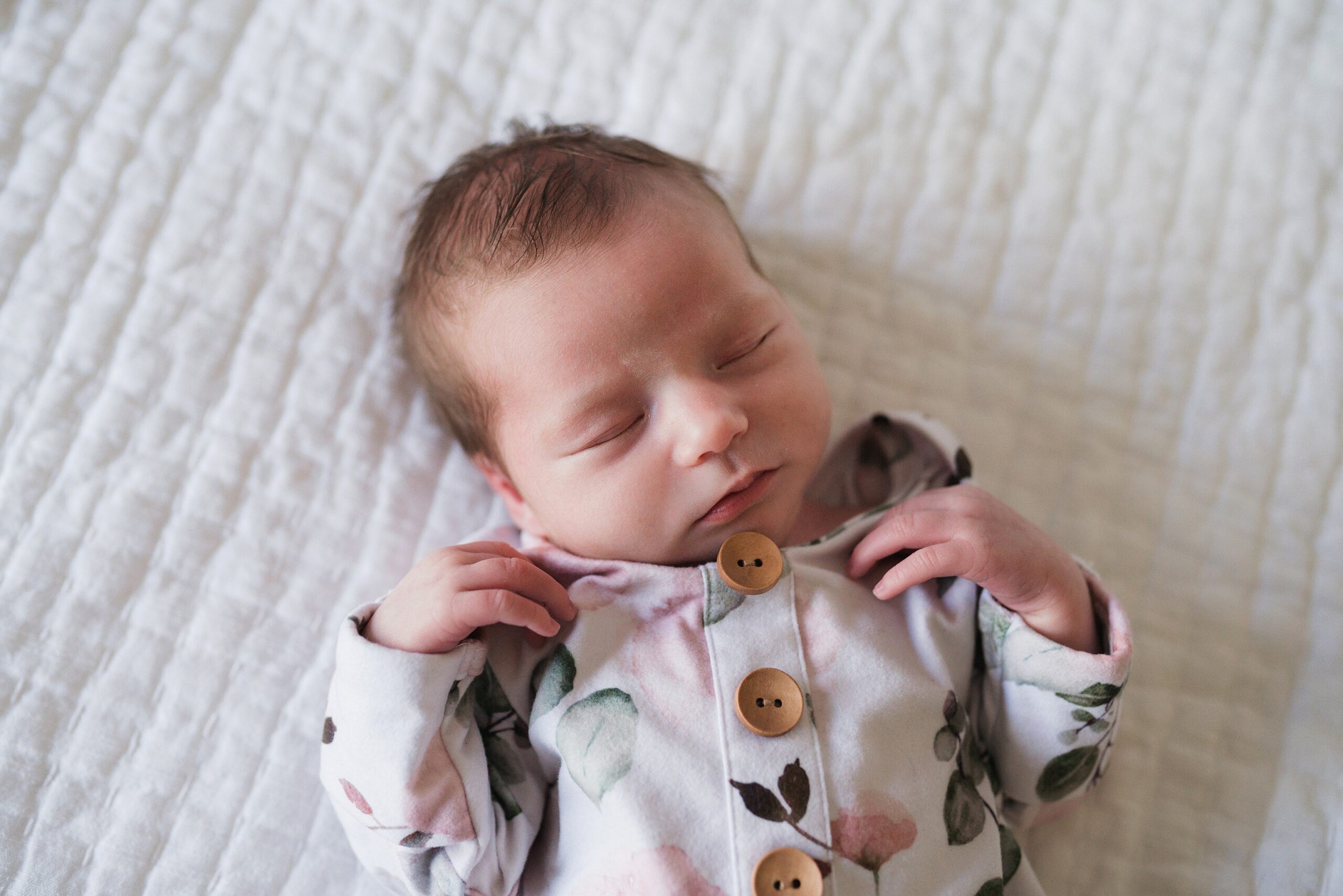 sleeping baby girl during newborn photo session