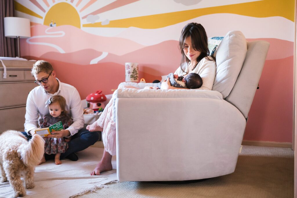 Family together in Seattle nursery during in home newborn photos