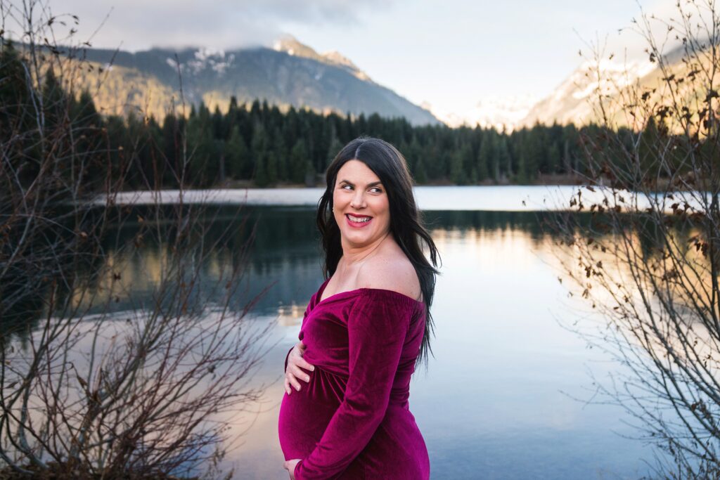 Maternity Photos at Snoqualmie Pass, women in red dress avoiding awkward maternity photos with Snoqualmie maternity photographer